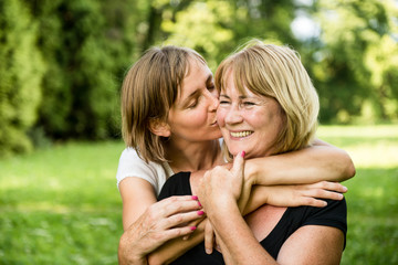 Love - mature woman with child portrait