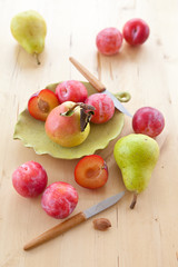 Fresh organic plums, pears and apples