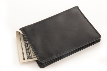 US dollars in a black wallet isolated on white