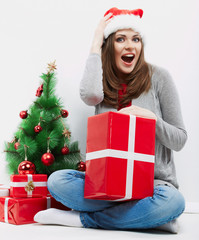 Christmas Santa hat isolated woman portrait hold christmas gift.