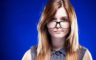 Disappointed young woman with nerd glasses, strict girl - obrazy, fototapety, plakaty