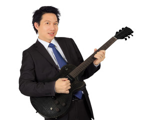 Obraz premium An asian male with a black electric guitar
