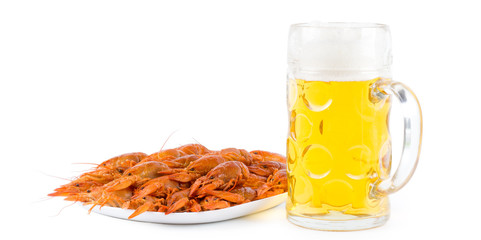 Shrimps on plate with a full beer mug
