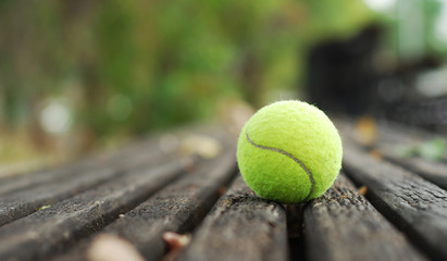 tennis ball on wood floor © yoki5270