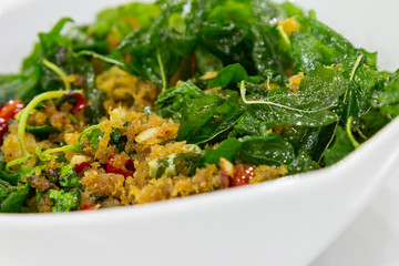 Fried basil with fish flake on blow