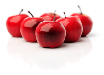 A set of six red plastic apples