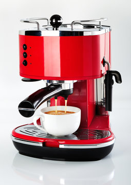 A Red Vintage Looking Espresso Coffee Machine Is Making A Coffee