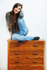 Teenager girl portrait at home. Young smiling woman with clothes