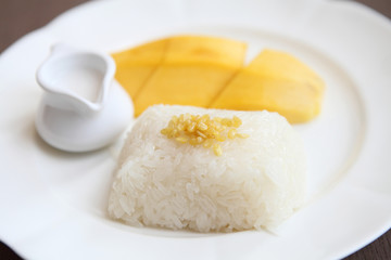 Sticky Rice with Mango on wood background