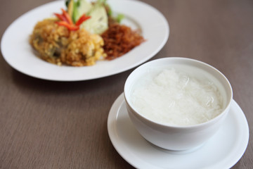 Jusmine rice in iced water such deep fried pork, onion, chili. A