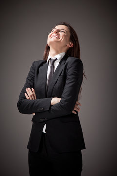 Portrait of a beautiful businesswoman with black suit and tie