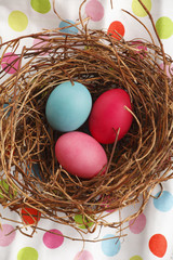 Naklejka na ściany i meble Close-up of easter eggs on white wooden table