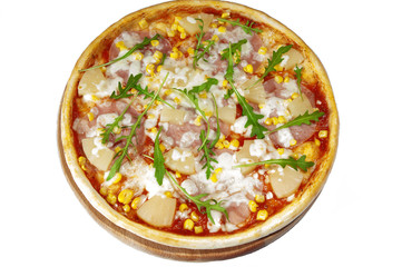 Exotic pizza with ham, pineapples, corn  on wooden stand.