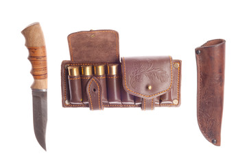 knife with scabbard and bandolier with hunting cartridges on a w