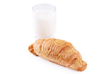Fresh and tasty French croissant with glass of milk