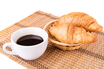 Fresh and tasty French croissants, cup of coffee served