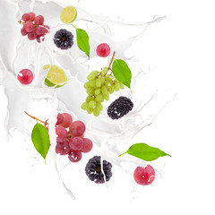 Fruits in milk splash, isolated on white background 