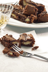 Pieces of chocolate brownies on a baking paper