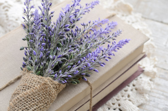 Bunch of lavender placed on book bundle