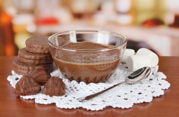 Bowl of chocolate and sweets on table in cafe