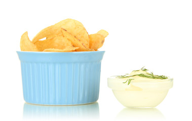 Potato chips in bowl and sauce, isolated on white