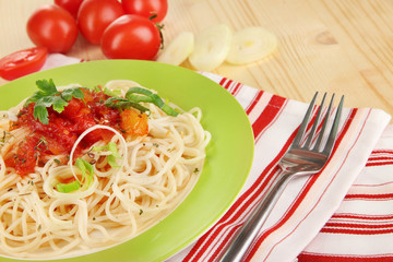 Tasty spaghetti with sauce and vegetables