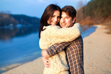 Young beautiful couple outdoor sensual portrait