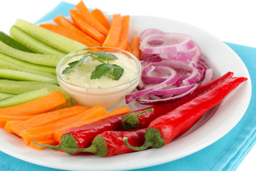 Assorted raw vegetables sticks in plate close up
