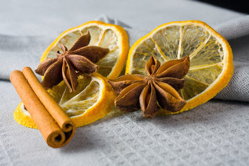 cinnamon sticks, anise stars and sliced of dried citrus