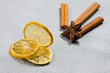 cinnamon sticks, anise stars and sliced of dried citrus
