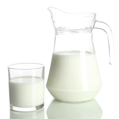 Tasty milk in jug and glass of milk isolated on white