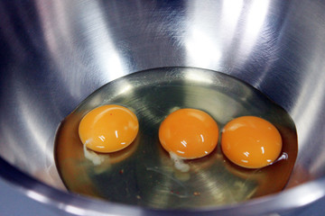 Three Egg Yolk in stainless Container.