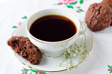 A Cup of coffee with chocolate biscuits