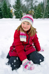 Fototapeta na wymiar Cute little girl outdoors in winter