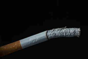Burning cigarette close up
