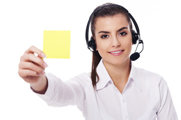 Female operator holding yellow note