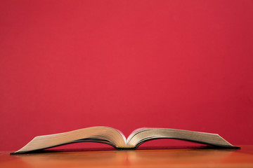 Open book lying on table