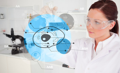 Chemist examining cell interface