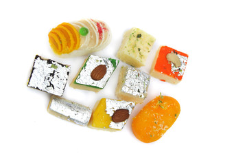 Various Indian sweets on white background