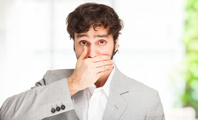 Man covering his mouth