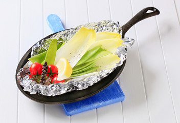 Fresh vegetables on tinfoil in skillet