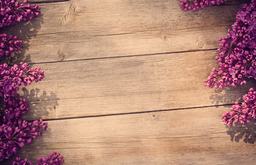 The beautiful lilac on a wooden background