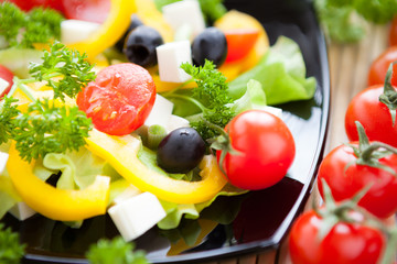 fresh vegetable salad with feta and olives