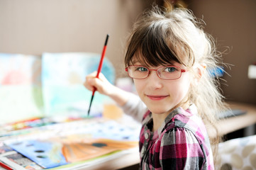 Cute little girl painting