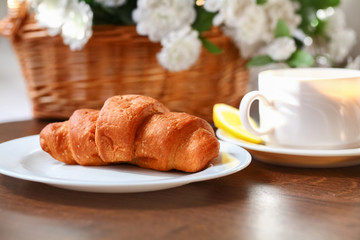 Cup of tea with french croissant