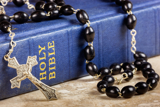 Rosary beads, cross and Bible