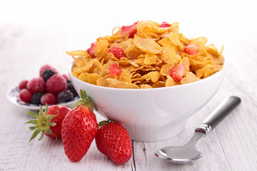 bowl of corn flakes with berries fruits © M.studio