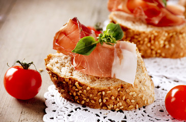 Jamon. Slices of Bread with Spanish Serrano Ham. Prosciutto