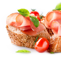 Jamon. Slices of Bread with Spanish Serrano Ham over White