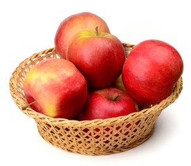Aplles in a basket on a white neutral background